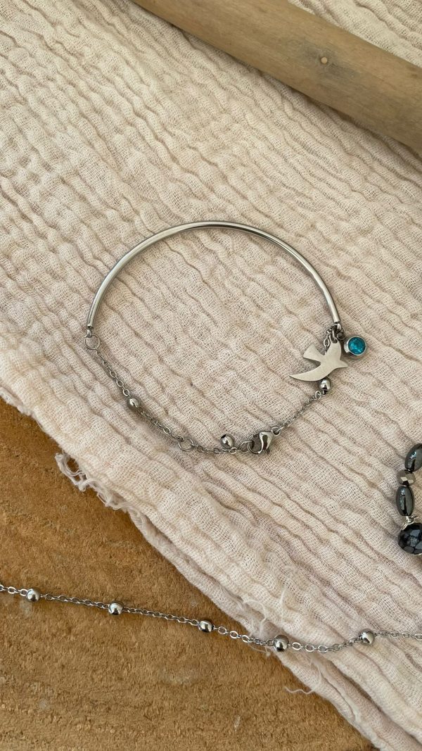 Bracelet argenté demi-jonc avec 2 petites breloques